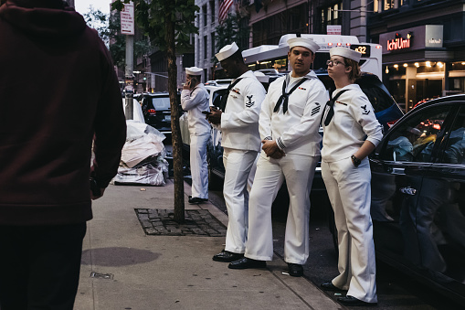 New York, USA - May 28, 2018: People in navy uniform on a street in New York on Memorial Day, holiday to remember the people who died while serving in armed forces.