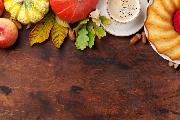 istock Autumn backdrop with pumpkins and fruits 1058738978