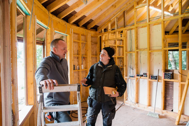lean business plan construction example images Discussing their Construction Work A young female blue collar worker discusses her construction work with her colleague. lean construction management stock pictures, royalty-free photos & images