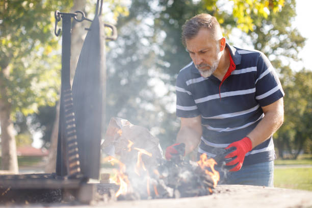 istock Man firing up the barbeque 1058741740