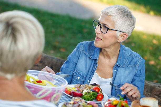 istock Senior women having a picnic 1058741976