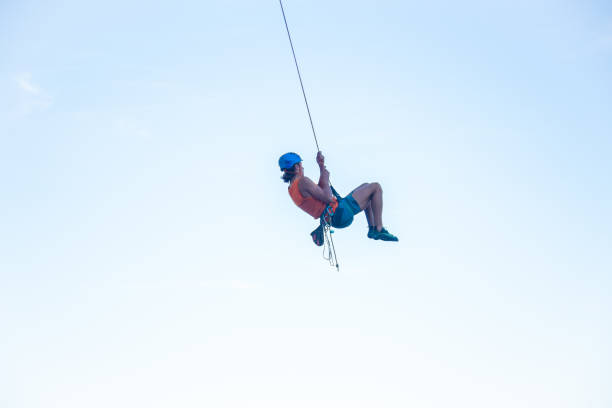 istock Man jumping with rope from mountain 1058744688