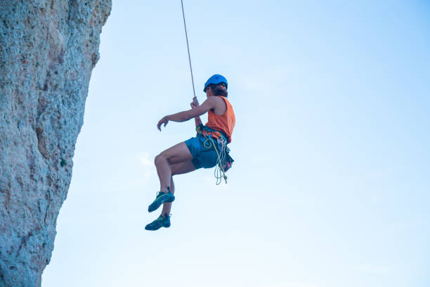 istock Man jumping with rope from mountain 1058744730