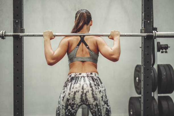 istock Young woman is doing cross training  exercise 1058746388