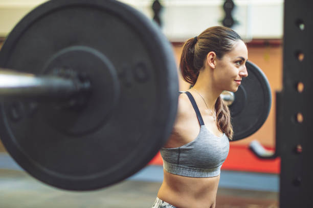 istock Young woman is doing cross training  exercise 1058746928