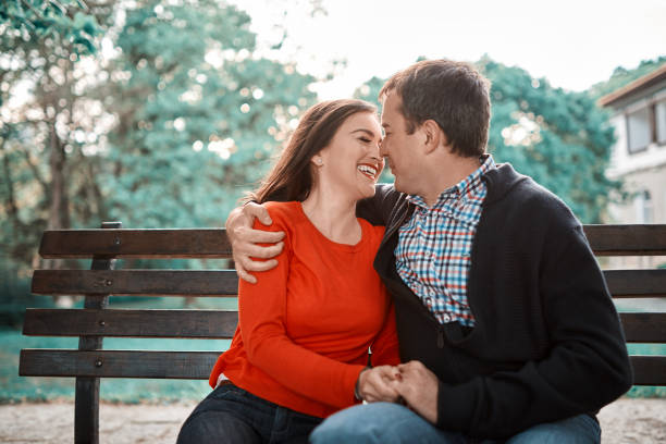 istock couple kissing in park 1058747416