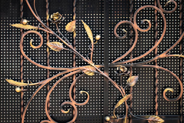 istock wrought-iron gates, ornamental forging, forged elements close-up 1058749404