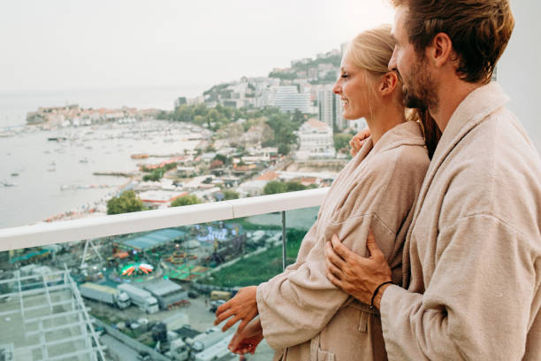 istock couple enjoying together in their bathrobes 1058757496