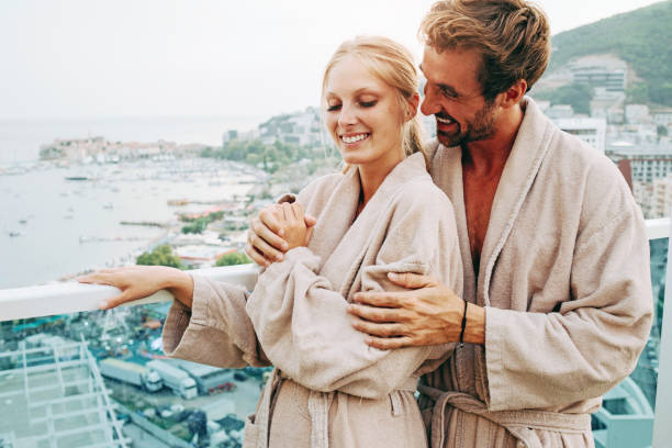 istock couple enjoying together in their bathrobes 1058758678