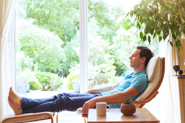 man relaxing at home after work, sleep and having rest on weekend. - infuse imagens e fotografias de stock