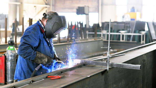 istock welder works in metal construction 1058758970
