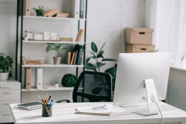 istock computer, table and chair in business modern office 1058759590