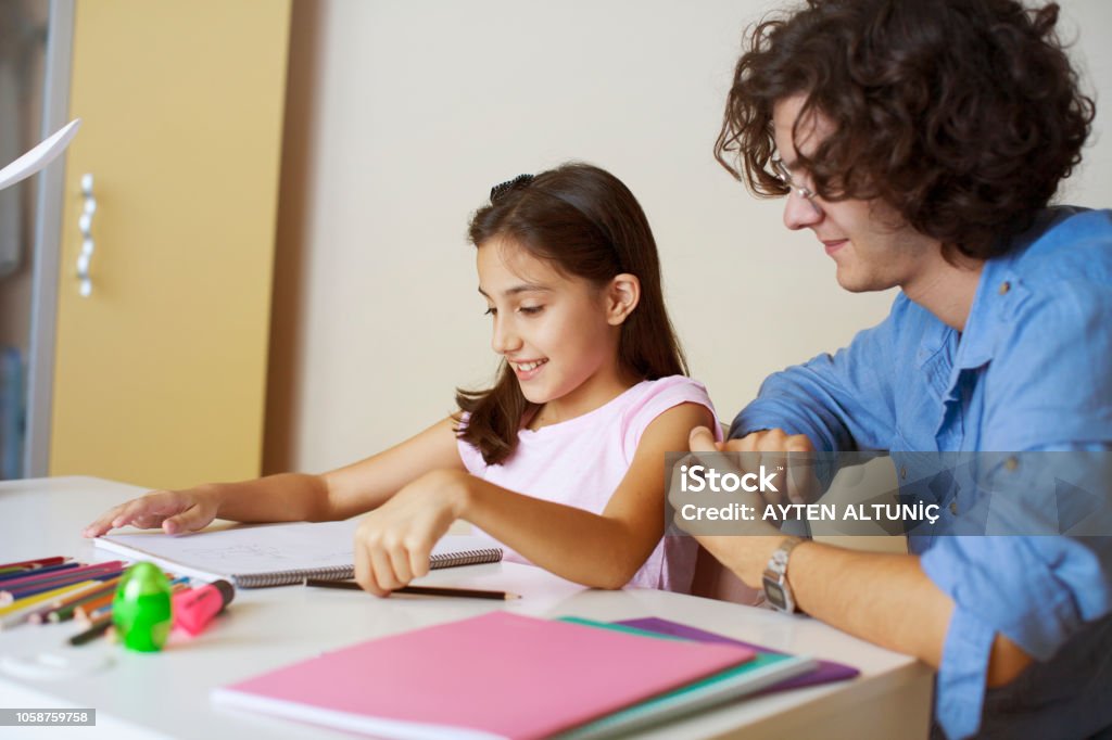 Learning together at home Friendship Stock Photo