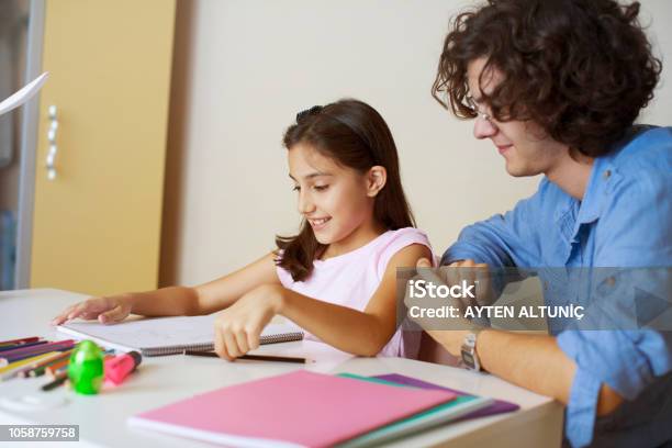 Learning Together At Home Stock Photo - Download Image Now - Friendship, Student, Teacher