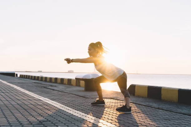 istock Young sportswoman stretching and preparing to run. 1058759982