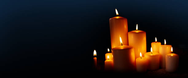 istock Burning candles in the dark night 1058760002