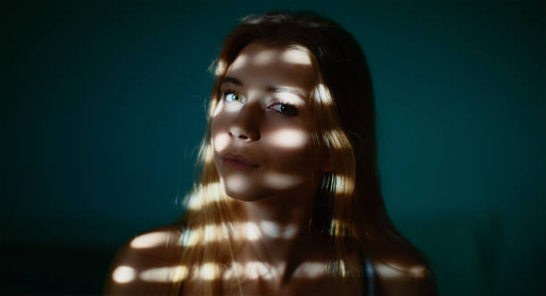 istock Young woman in the dark 1058767844
