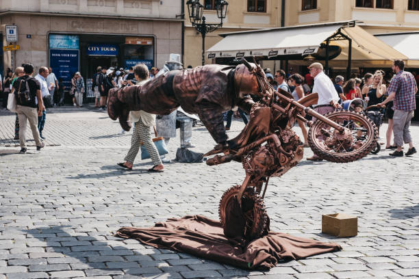 Prague, Czech Republic - August 23, 2018: Living statue, a street artist posing as a statue for hours at a time, in Old Town Square, a historic square in the Old Town quarter of Prague.