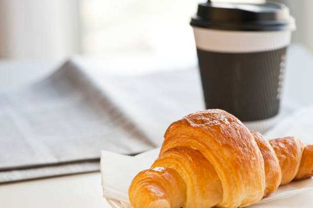 istock croissant and coffee 1058777262