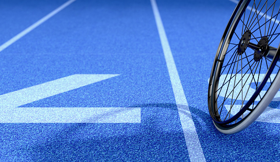 An empty modified wheelchair used by handicapped athletes to compete in various sporting codes on a blue marked athletics track background - 3D render