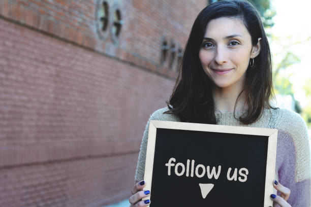 istock Woman holding chalkboard with 