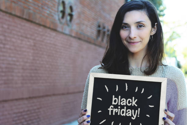 istock Woman holding chalkboard. Sale concept. 1058781502