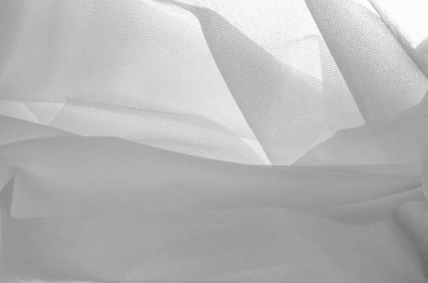 istock Texture, background, pattern. Texture of silk fabric - White. Silk fabric is transparent. Fabric or liquid wave illustration wavy creases of silk satin texture or velvet material or white 1058781876