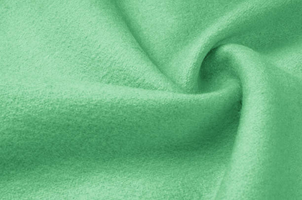 istock Texture, background, pattern. Woolen fabric for outdoor clothing, pale green. Colorful, fresh spring fresh green. More of this motif and more textiles in my port. 1058782016