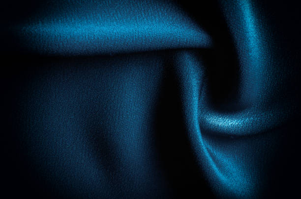 istock Texture, background. template. Silk fabric blue, Blue silk drapery and upholstery fabric from the courtyard - Dark curtains - Solid fabrics for backs and pillows 1058782060