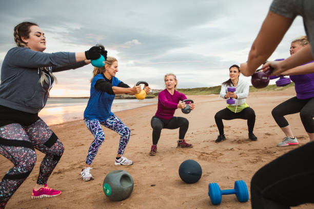 istock Women Exercising at the Beach 1058783092