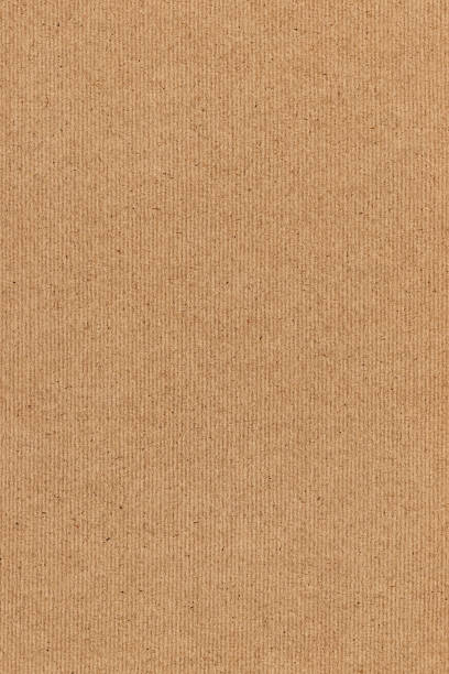 istock Coarse Grain Striped Brown Recycled Manila Kraft Paper Coarse Background Texture Sample 1058784914