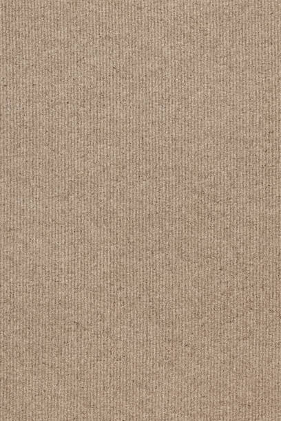 istock Coarse Grain Striped Brown Recycled Manila Kraft Paper Coarse Background Texture Sample 1058786250