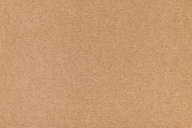 istock Coarse Grain Striped Brown Recycled Manila Kraft Paper Coarse Background Texture Sample 1058788578