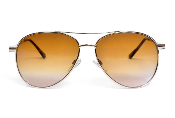 istock Gold colored sunglasses, isolated on white 1058793178