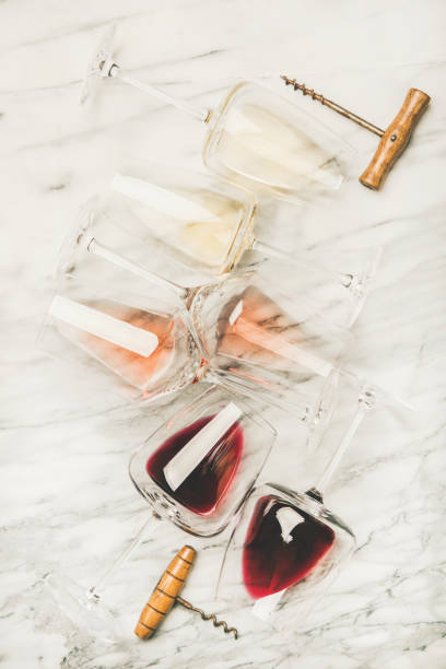 Red, rose and white wine in glasses and corkscrews