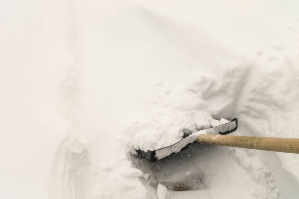 istock Clearing snow with a snow shovel 1058796886
