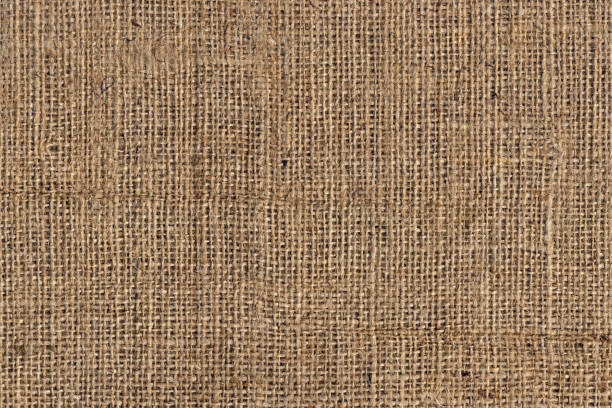 tela di tela burlap marrone naturale grunge a grana grossa trama di sfondo - sandbag burlap sack burlap sack foto e immagini stock