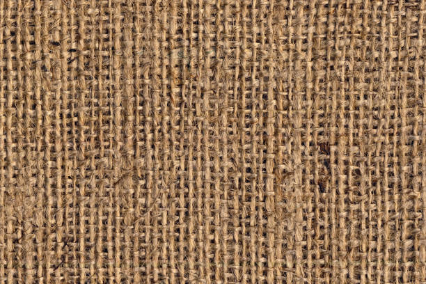 tela di tela burlap marrone naturale grunge a grana grossa trama di sfondo - sandbag burlap sack burlap sack foto e immagini stock