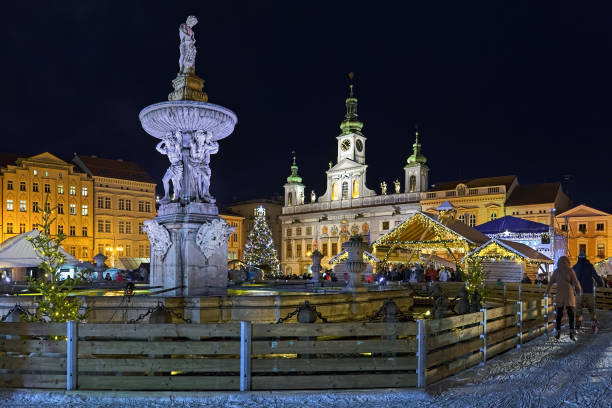 Christmas market in Ceske Budejovice, Czech Republic Ceske Budejovice, Czech Republic - December 8, 2017: Christmas market at the Premysl Otakar II Square with ice-skate rink around the Samson fountain in night. The Town Hall is visible in the background. cesky budejovice stock pictures, royalty-free photos & images