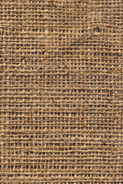 tela di tela burlap marrone naturale grunge a grana grossa trama di sfondo - sandbag burlap sack burlap sack foto e immagini stock