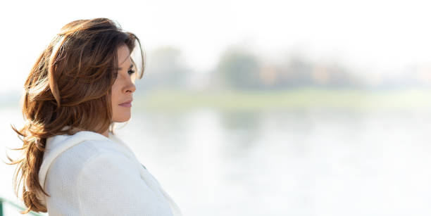 istock Portrait of a nostalgic woman 1058803050