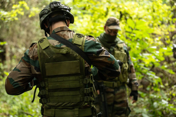 istock Military Unit Exercising In Nature 1058803344