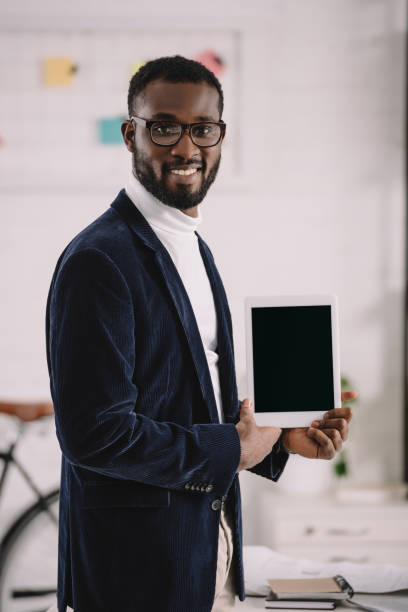 istock successful african american businessman presenting digital tablet with blank screen 1058803680