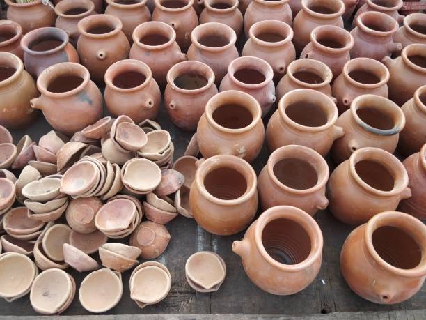 istock Ceramic pots stacked for sale at market 1058803972