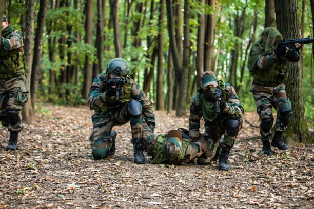istock Military Paramedics Helping Injured Soldier 1058804004