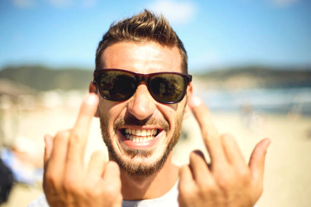istock Young man shows the middle finger 1058806354