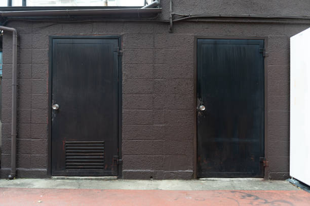 istock sidewalk by street wall & door 1058807288