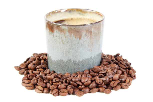 istock Coffee cup and coffee beans on the white background 1058811744
