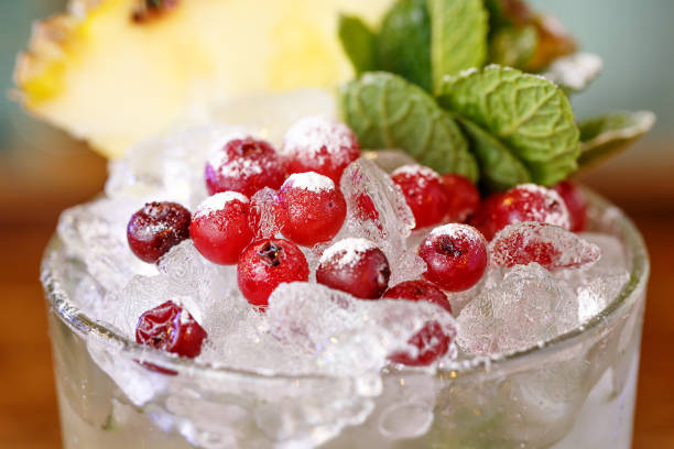 istock Close-up of cranberries with mint on ice. Fresh background for a cocktail menu. 1058814890