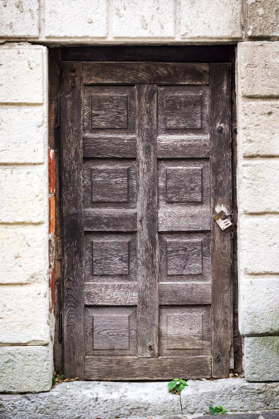istock Beautiful old gate on the stone wall background. Close-up. Architecture. 1058816646